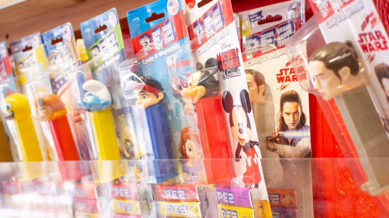 various PEZ dispensers on a shelf