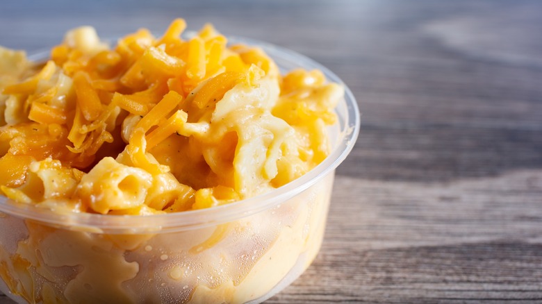 A plastic container of mac and cheese