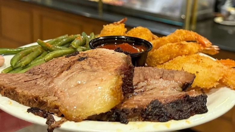 plate of brisket fried shrimp veggies