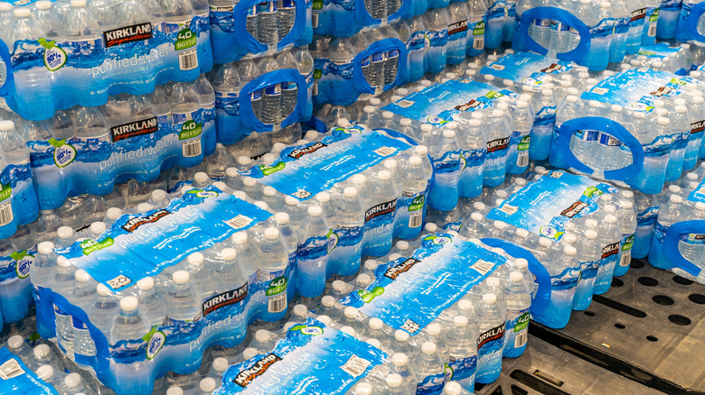 Several cases of Kirkland Signature purified water on display