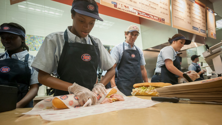 Jersey Mike's staff members making sandwiches.