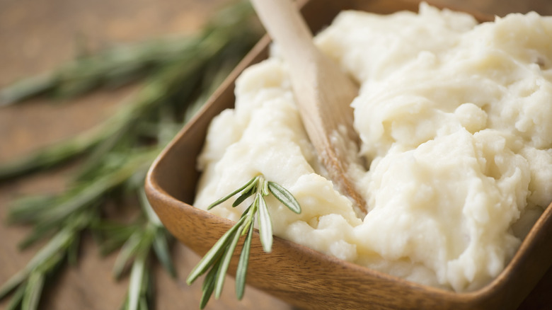 mashed potatoes with green herb garnish