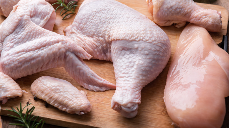 Raw chicken arranged on a cutting board