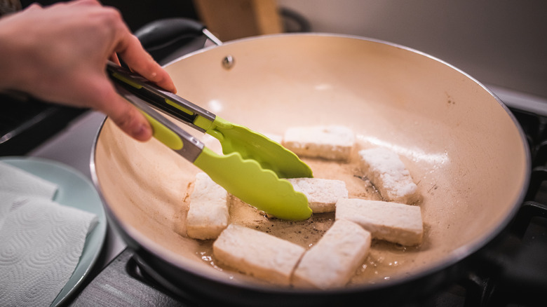 Frying tofu in a pan