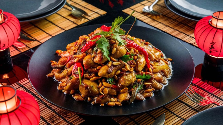 Kung pao chicken on black plate