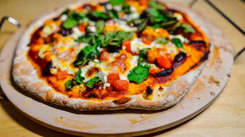 pizza with baking stone underneath