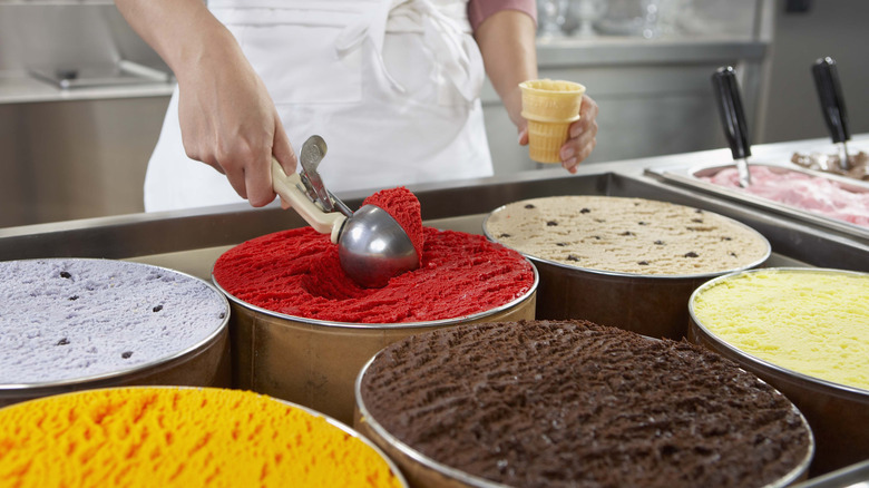 Ice cream being scooped for a cone