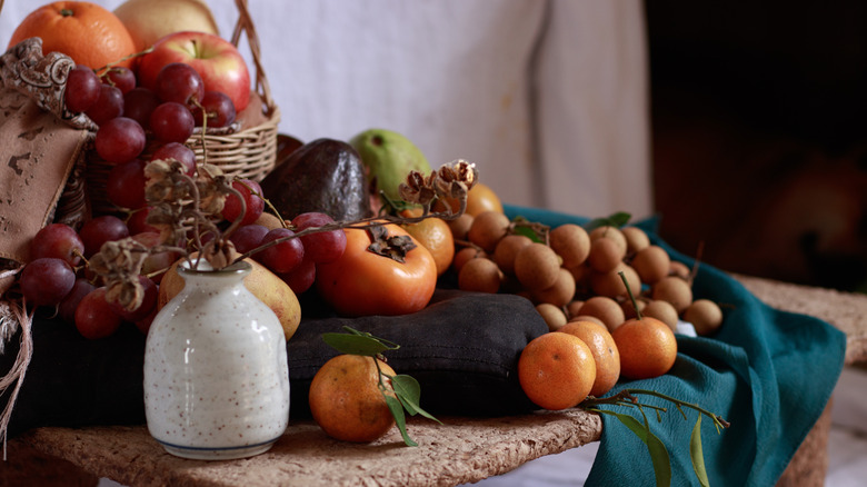 A table donned with round fruits