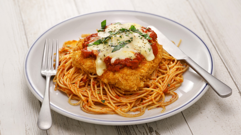 chicken parmesan on a white dish