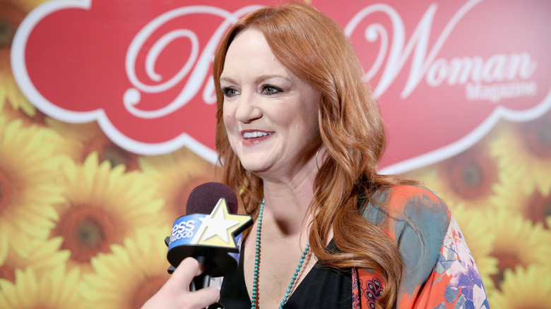 Ree Drummond wearing dangly earrings with microphone