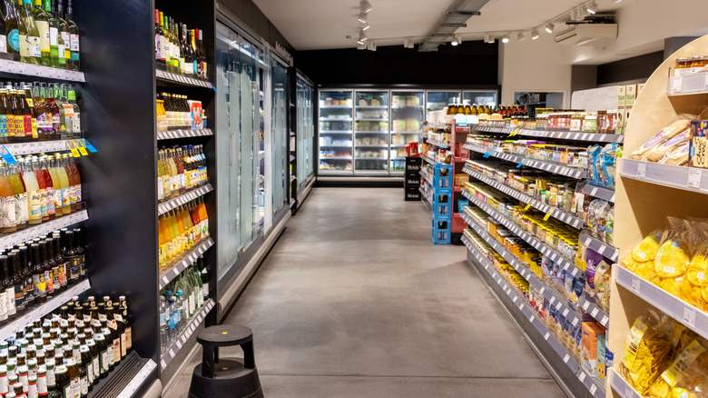 The interior of a grocery store's drinks and cold food section