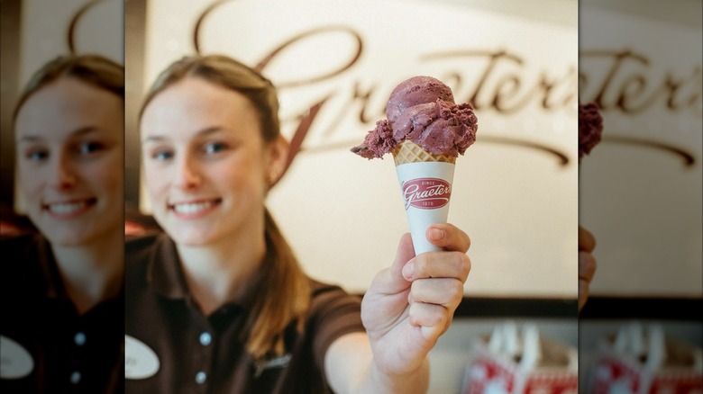 Graeter's in Hyde Park with worker holding ice cream cone