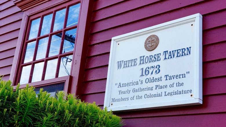 Close-up of sign that reads: White Horse Tavern 1673, "American's Oldest Tavern," Yearly Gathering Place of the Members of the Colonial Legislature.