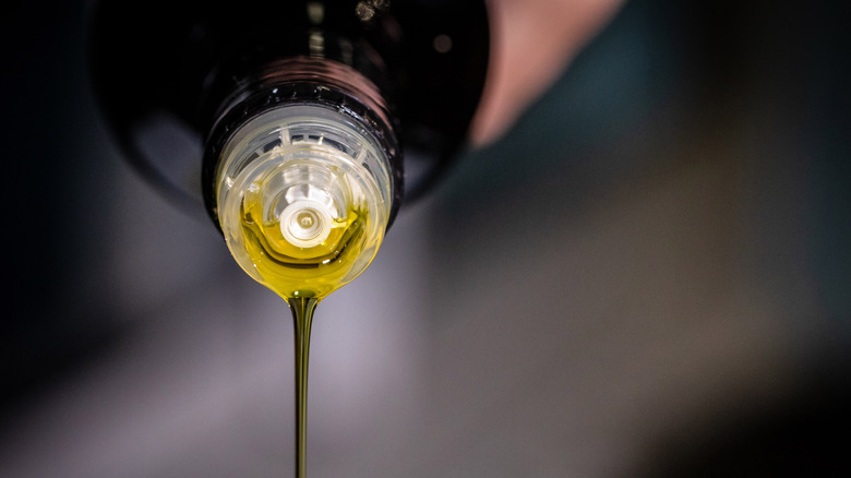 Olive oil being poured from the bottle