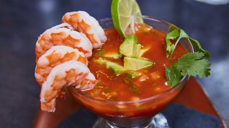 Shrimp cocktail served in a martini glass.