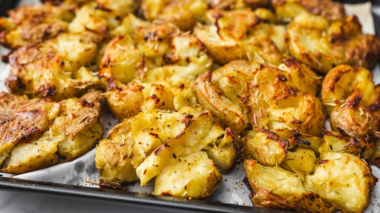 smashed potatoes on a baking sheet