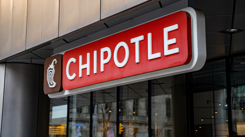 A Chipotle sign outside of the chain restaurant