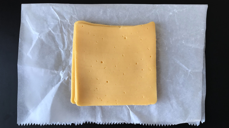 American cheese slices on deli paper