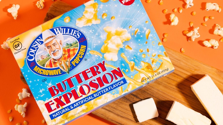 A box of Cousin Willie's popcorn with kernels and butter