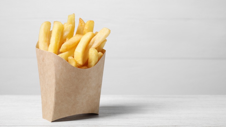 french fries in a paper container