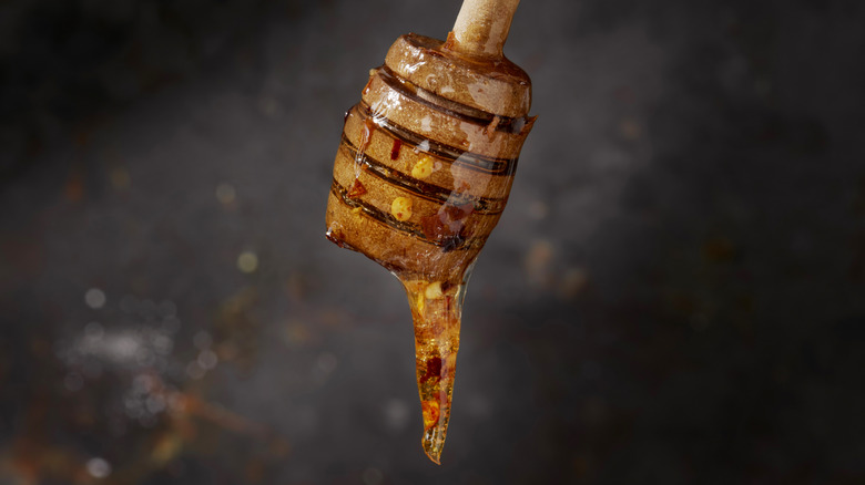 hot honey dripping from a honey stick