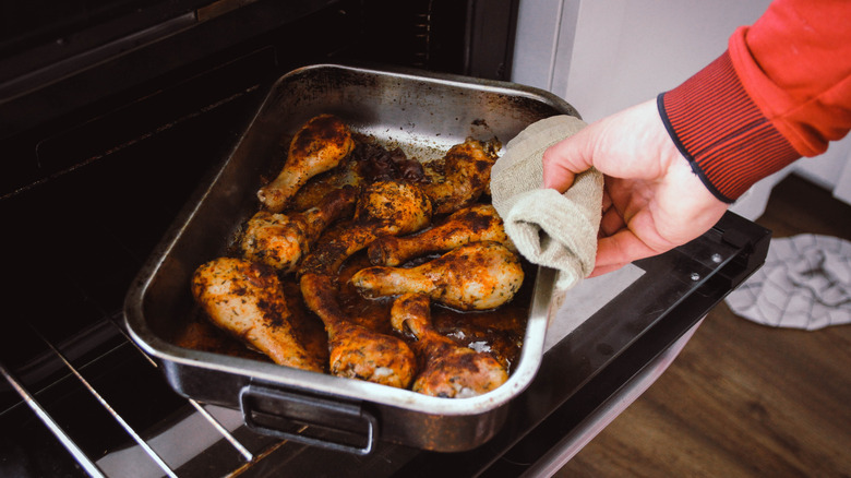 baked chicken in a pan in the oven