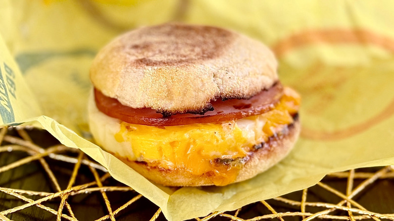 Egg McMuffin sandwich on paper wrapper