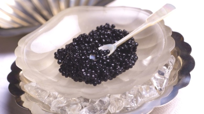 A serving of caviar in a glass dish