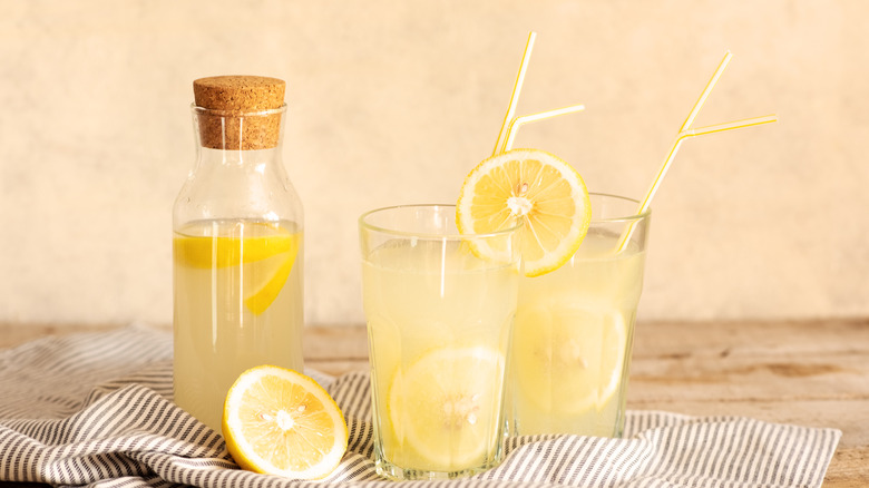 Jar and glasses of lemonade