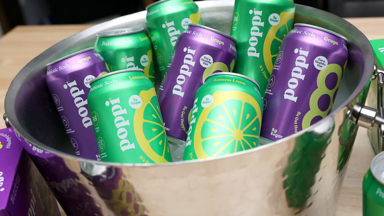 A bucket full of cans of Poppi, the prebiotic soda