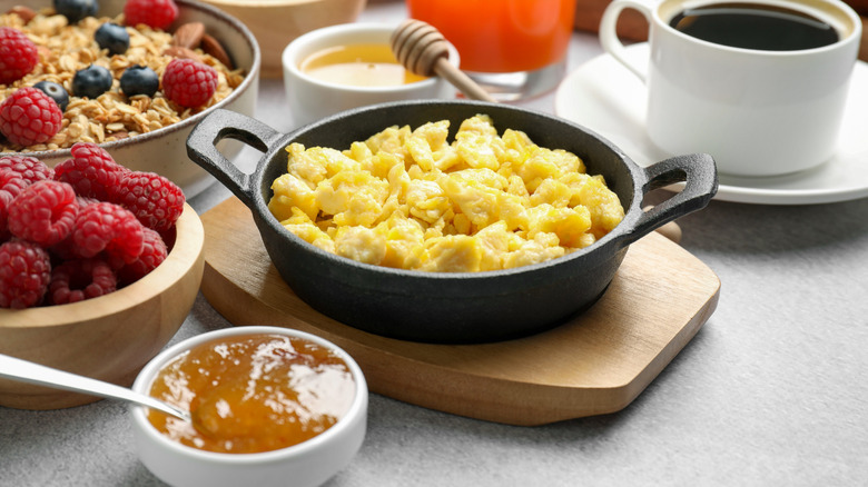 A close up photo of a table with breakfast items on it