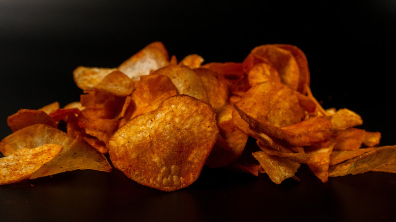 dark potato chips on dark background