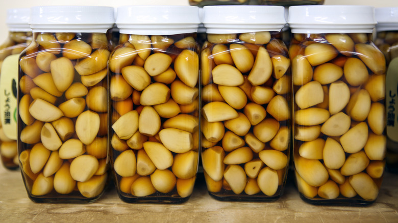 Four jars of pickled garlic