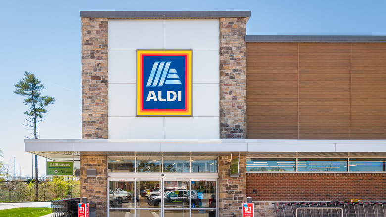 aldi exterior with wood and brick wall