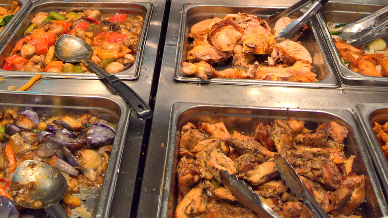 Assortment of foods in a grocery store hot bar