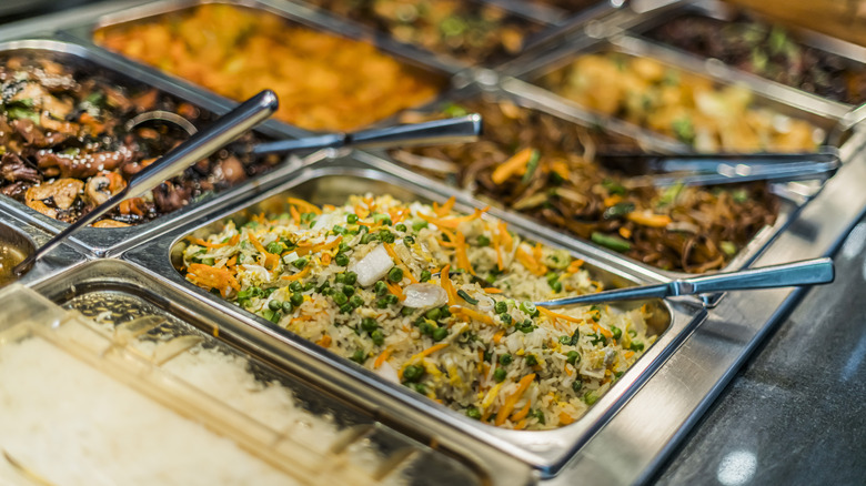 Hot food bar with serving utensils