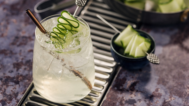 Cocktail with cucumber garnish