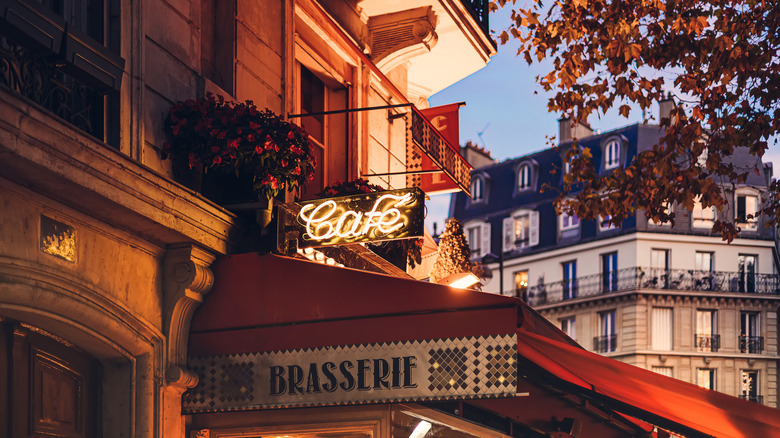 cafe and brasserie sign on Paris streetcorner at sunset