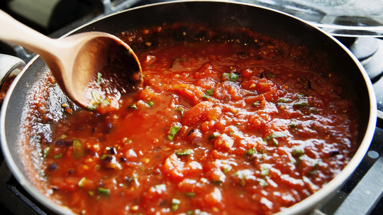 Tomato sauce being cooked in a pan on the stove