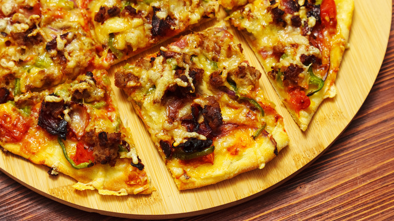 aerial view of part of a round pizza cut into squares