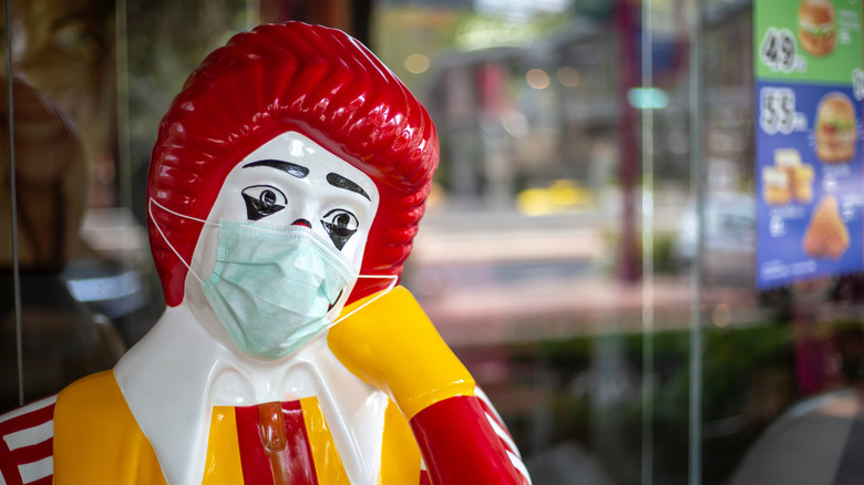 Ronald McDonald's with a mask on during COVID-19