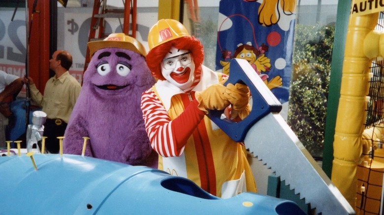 Ronald McDonald and Grimace construct a PlayPlace