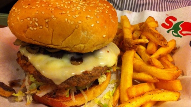 Swiss cheeseburger at Chili's in basket with fries