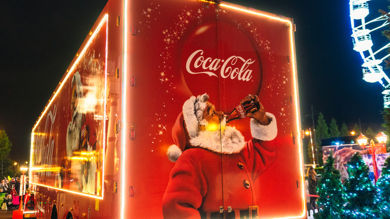 A Coca-Cola truck shows Santa sipping on a coke