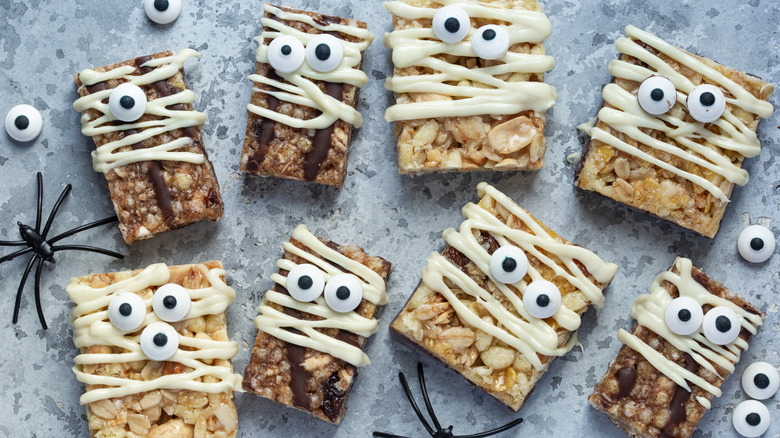 plate of rice krispie treats decorated like mummies