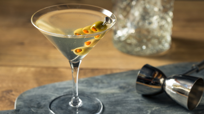 Dirty martini with three olives