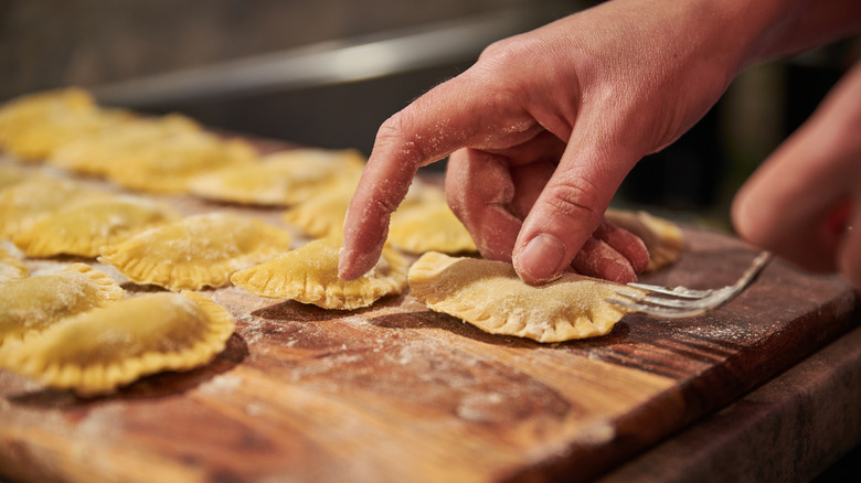 A person crimping homemade ravioli