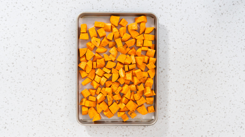 chopped up sweet potato slices ready to go in oven