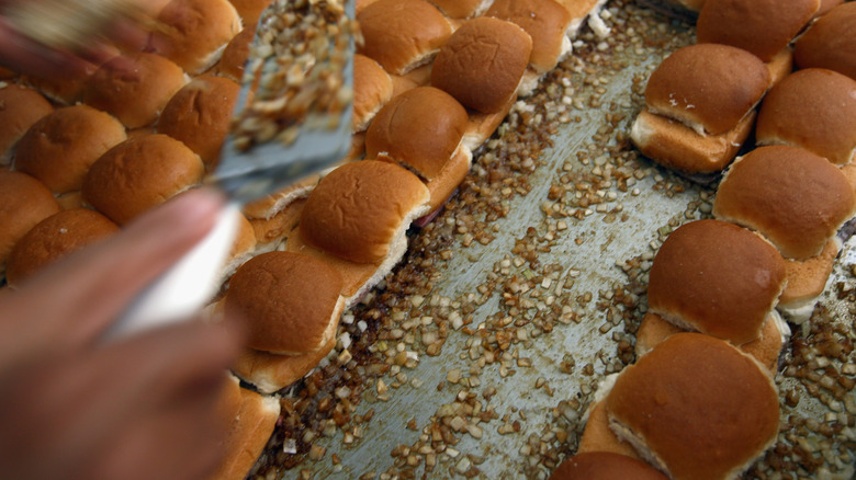 White Castle sliders on a bed of chopped onions