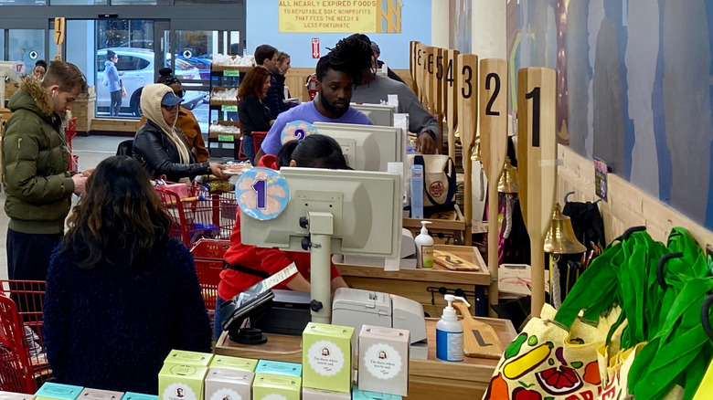 busy check-out lanes in a Trader Joe's